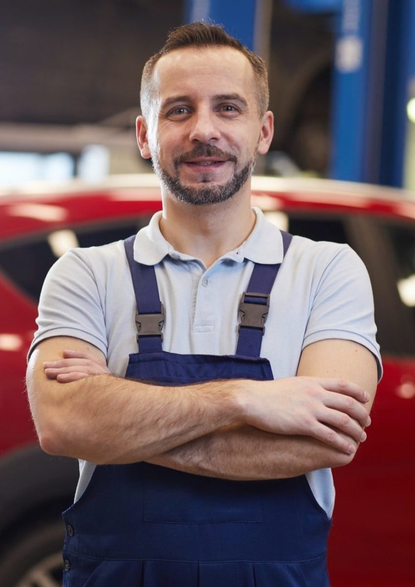 Mechanic Posing With Red Car E1651031623518